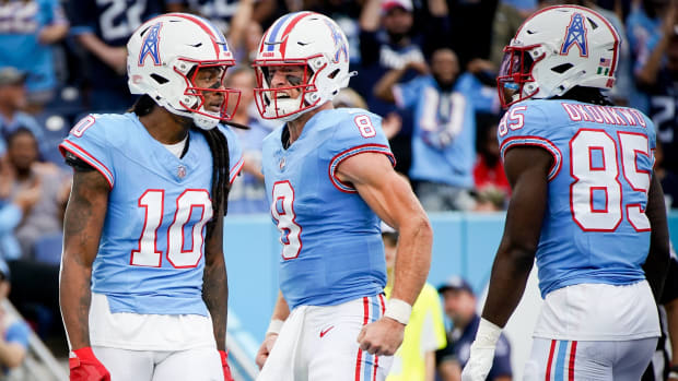 Tennessee Titans quarterback Will Levis (8) reacts after wide receiver DeAndre Hopkins (10) received a pass for a touchdown against the Atlanta Falcons during the first quarter at Nissan Stadium in Nashville